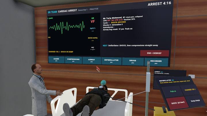 Cardiac arrest team simulation with monitor and defibrillator